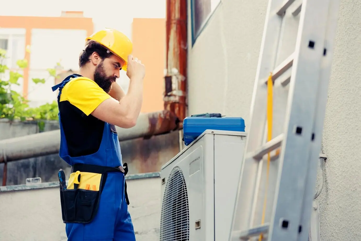 A skilled electrician hired to inspect an outdoor air conditioner at the start of a work shift. The trained worker, wearing protective gear, is preparing to service a faulty external HVAC system.
